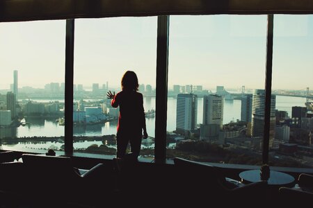 Woman window cityscape