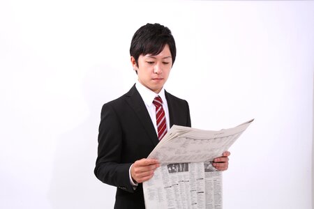 Business man reading newspaper photo