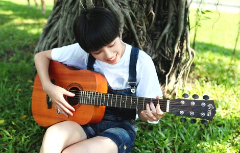 Girl playing guitar photo