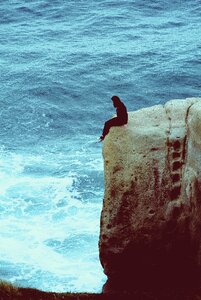 Rock cliff sea woman