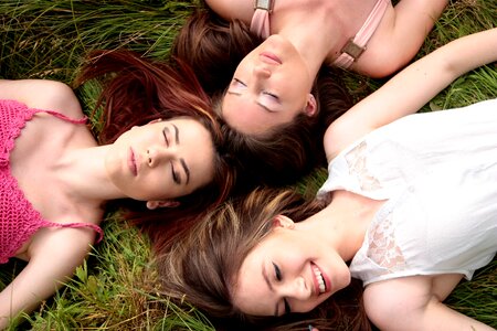 Three women grass photo
