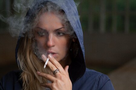 Woman smoking cigarette photo