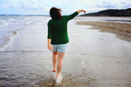 Beach woman walking photo