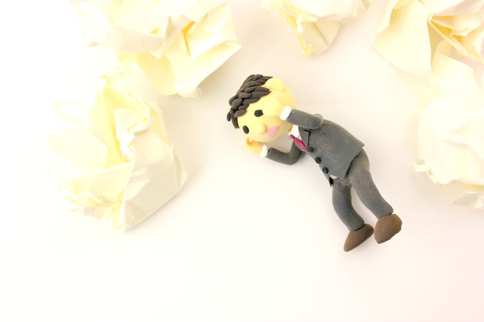 Business man doll troubled