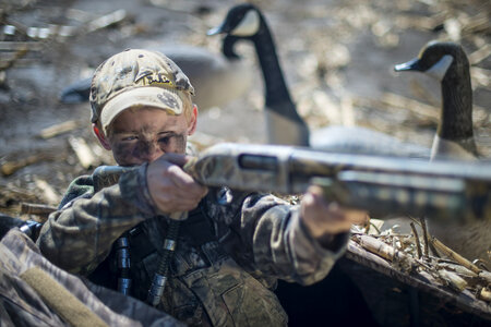 Child boy hunting gun