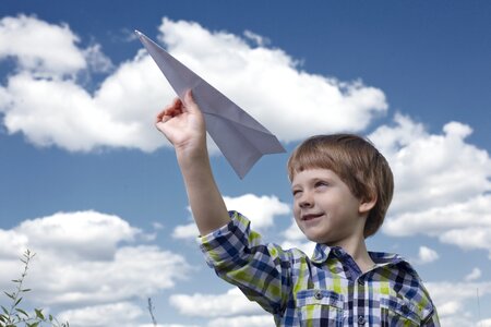 Child boy paper plane