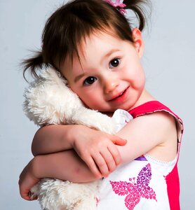 Child girl hugging photo
