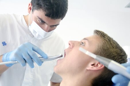 Dentist treating patient