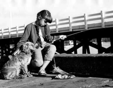 Girl fishing dog