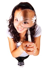 Girl magnifying glass photo