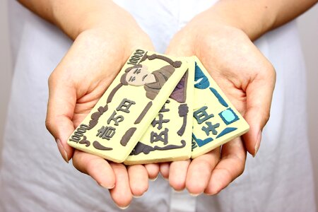 Hands money clay