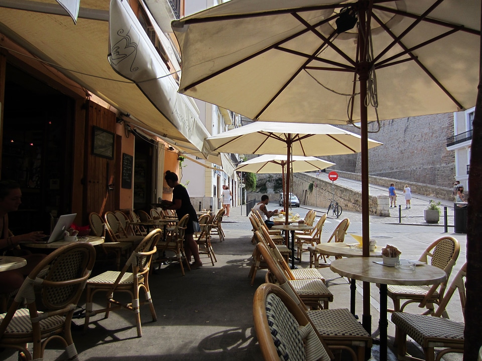 Umbrellas tables chairs