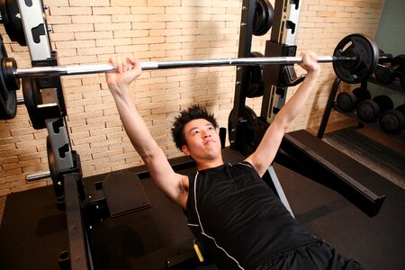 Man training bench press