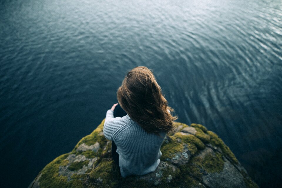 Rock cliff sea woman