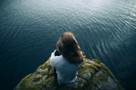 Rock cliff sea woman photo