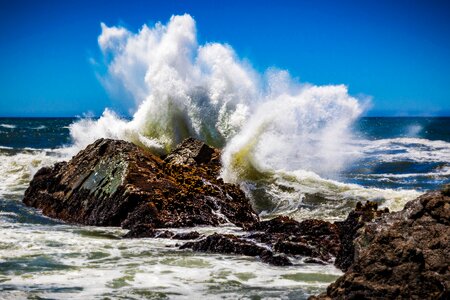 Sea wave splash rock photo