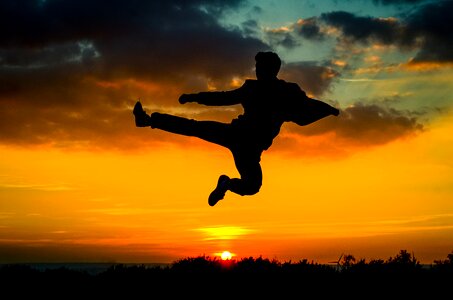 Sunset kick man silhouette photo