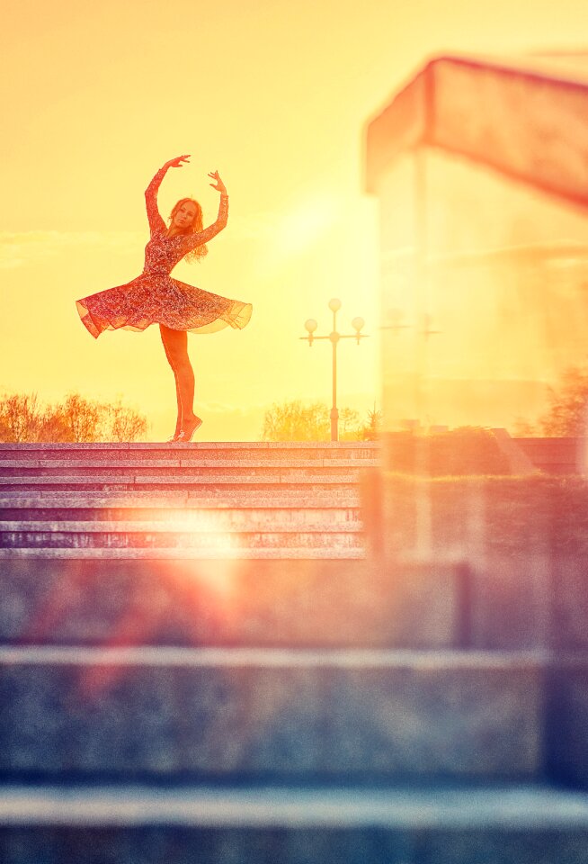 Woman ballerina sunset