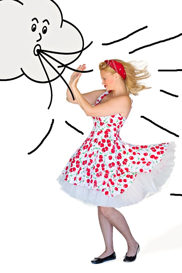 Woman blowing wind