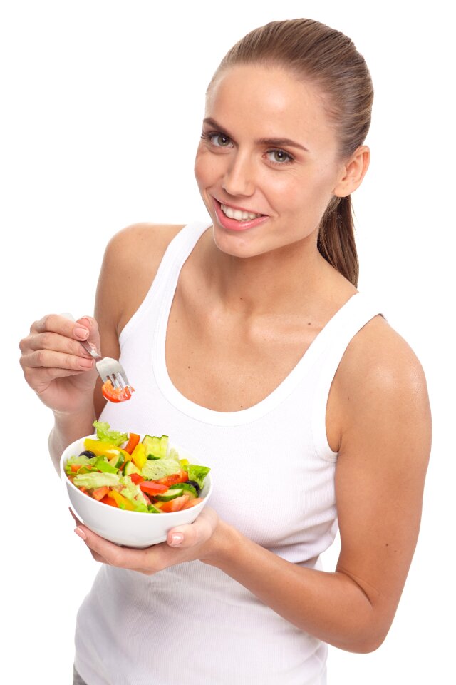 Woman eating salad