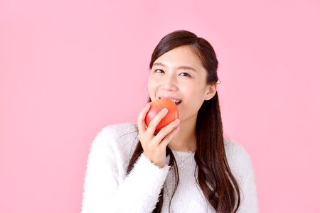 Woman girl eating apple photo