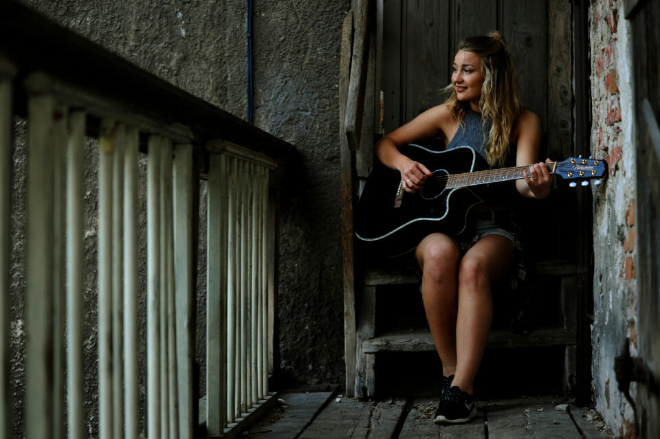 Woman girl playing guitar photo