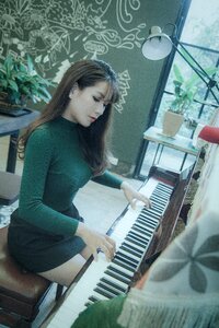 Woman playing piano photo