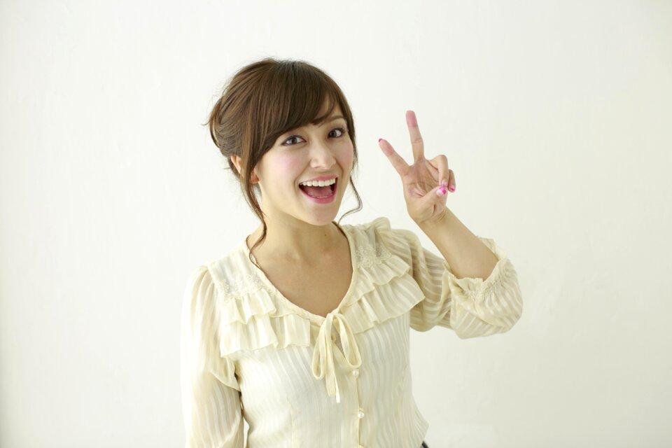Woman portrait v sign