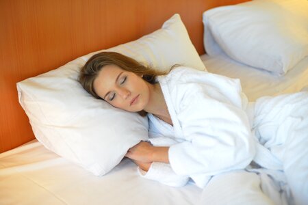 Woman sleeping bed photo