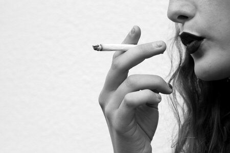 Woman smoking cigarette photo