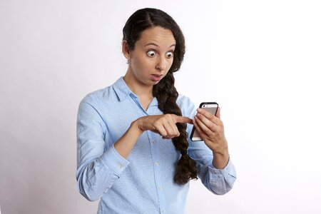 Woman surprised smartphone photo