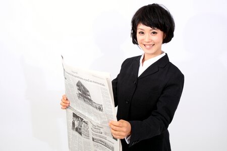 Business woman newspapser