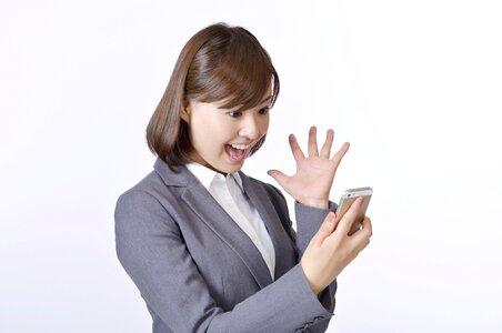 Businessman surprised smartphone photo