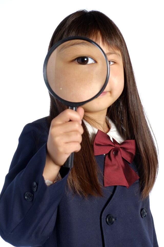 Child girl magnifying glass