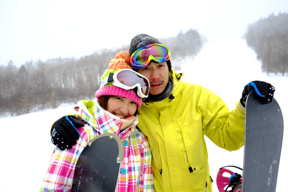 Couple snowboarding sports