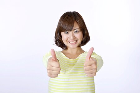 Woman girl thumbs up photo