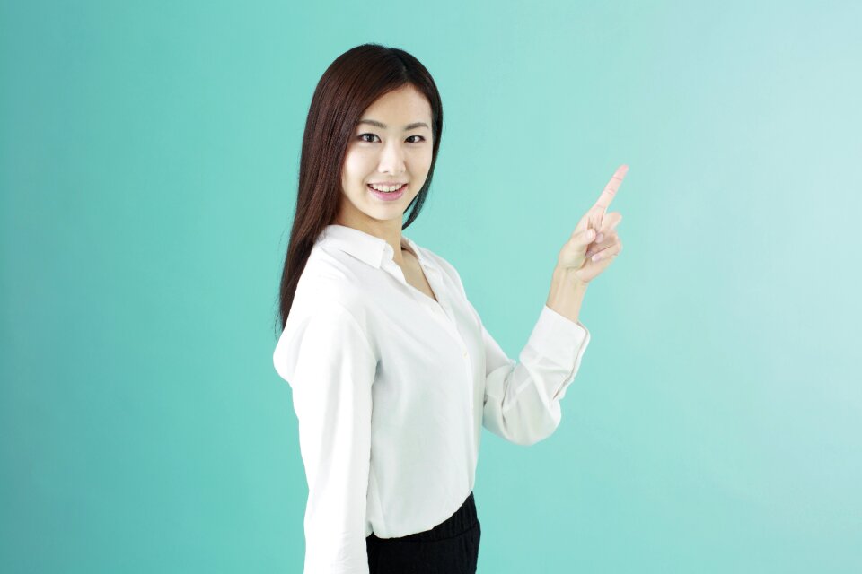 Business woman pointing finger