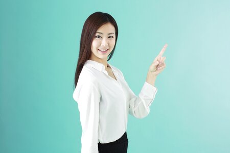 Business woman pointing finger