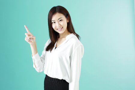 Business woman pointing finger photo