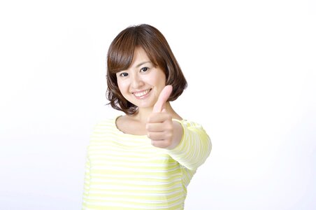 Woman girl thumbs up photo