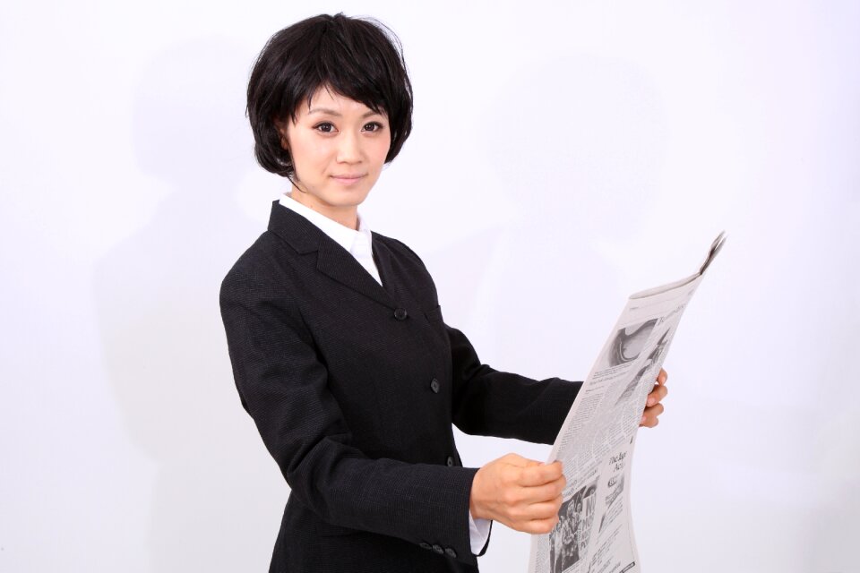 Business woman newspapser
