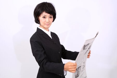 Business woman newspapser