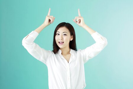 Business woman pointing finger photo