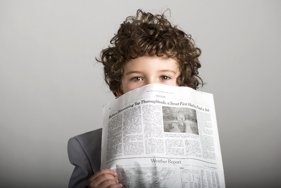 Child boy newspaper