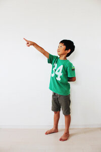 Child boy pointing finger photo