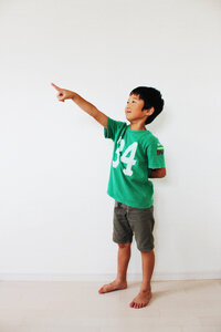 Child boy pointing finger