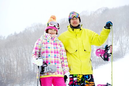 Couple snowboarding sports