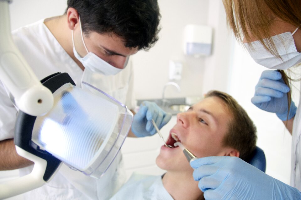 Dentist treating patient