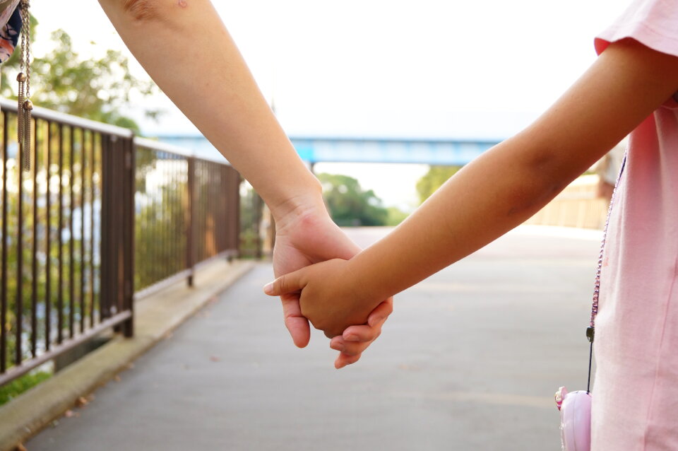 Parent child holding hands