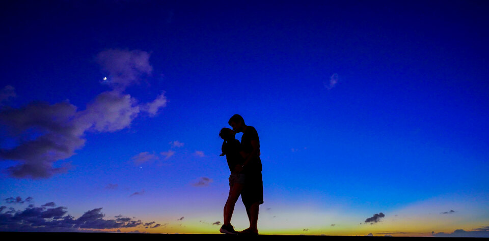Sunset couple kiss